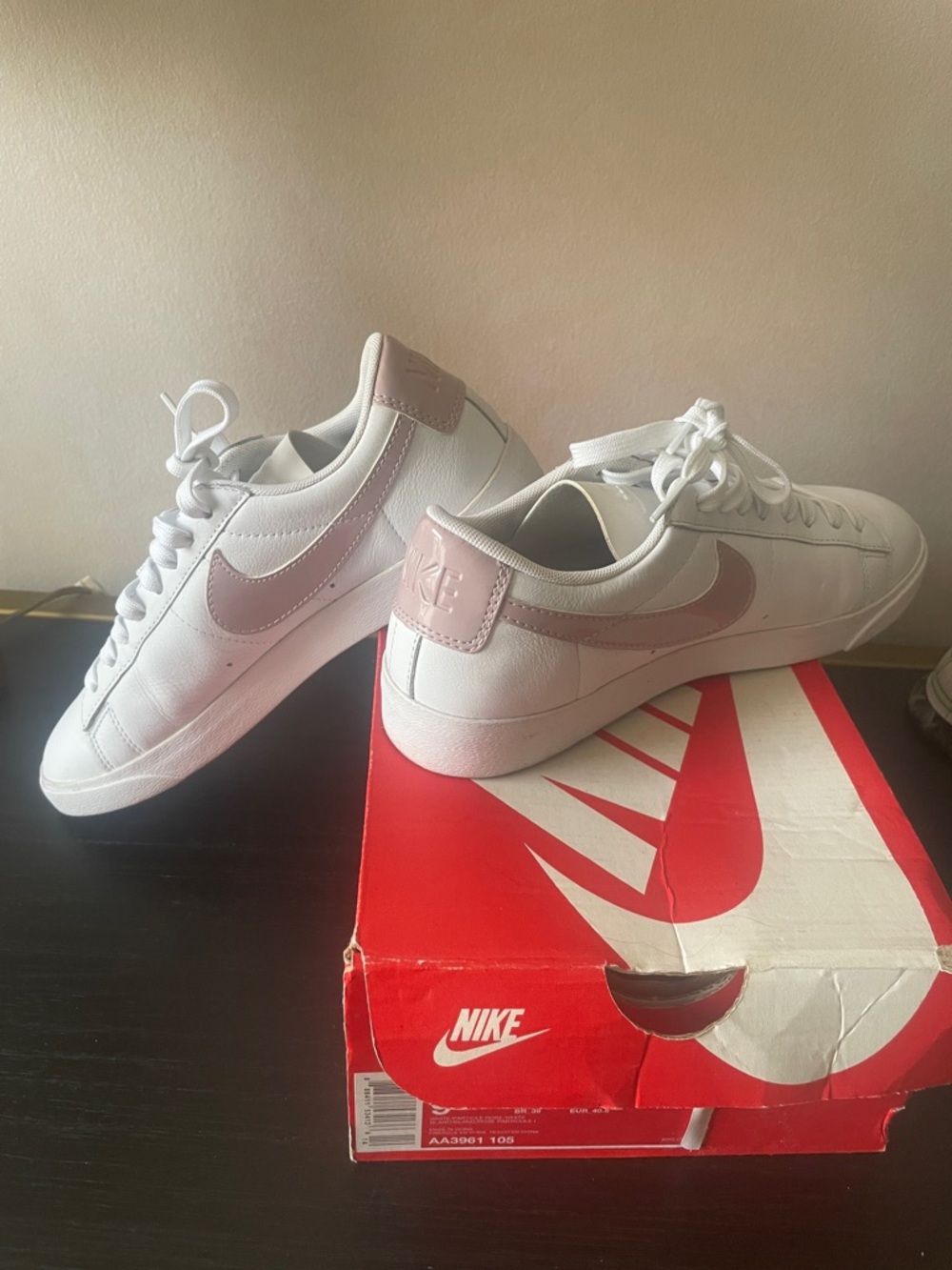 Nike White Low-Top Sneakers with Rose Swoosh